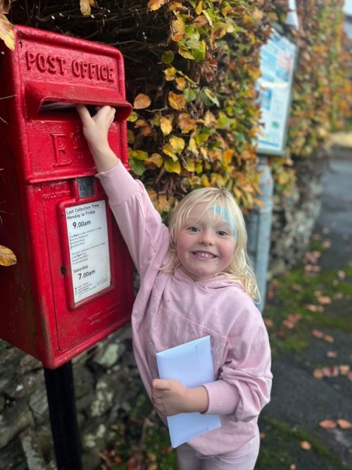 Layla helping with this month’s direct mail campaign