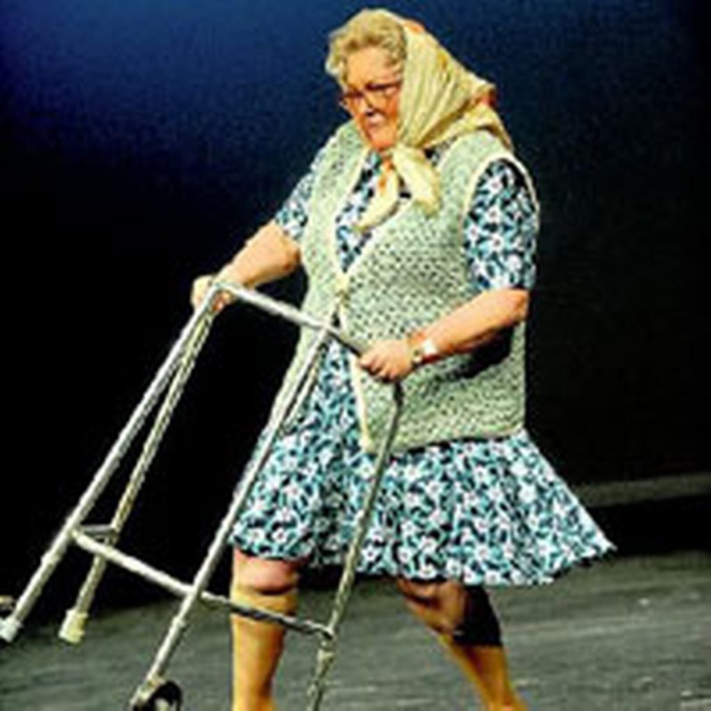 Elderly woman with walking frame